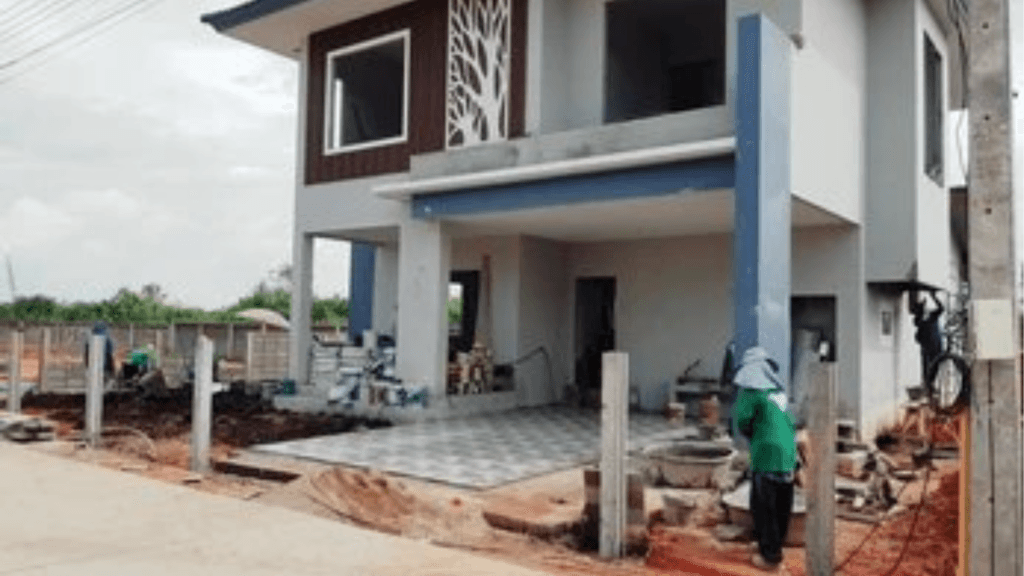 Modern residential building construction site in Bangalore with skilled laborers.